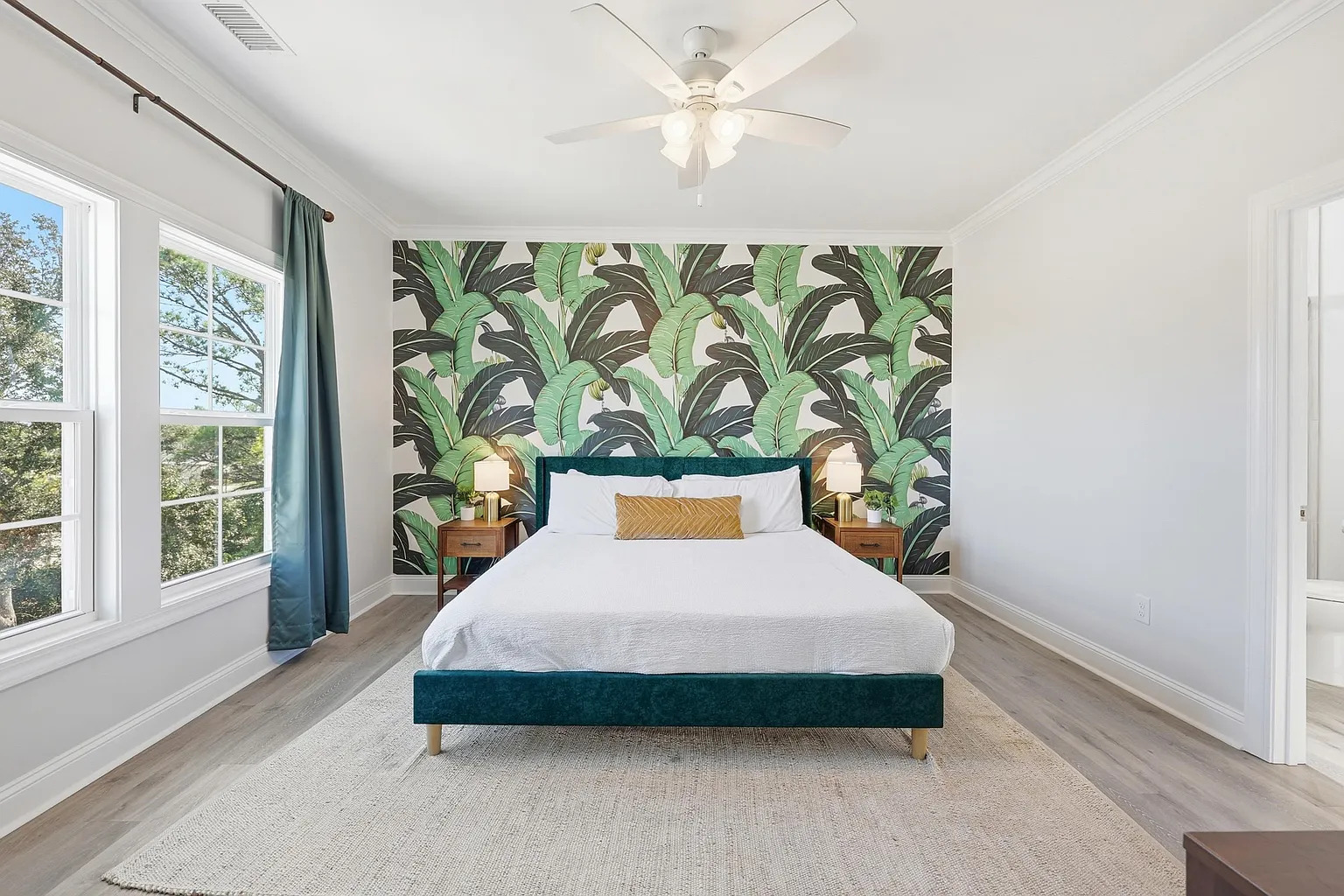 Bunk room with tropical mural wallpaper at Banana Villa