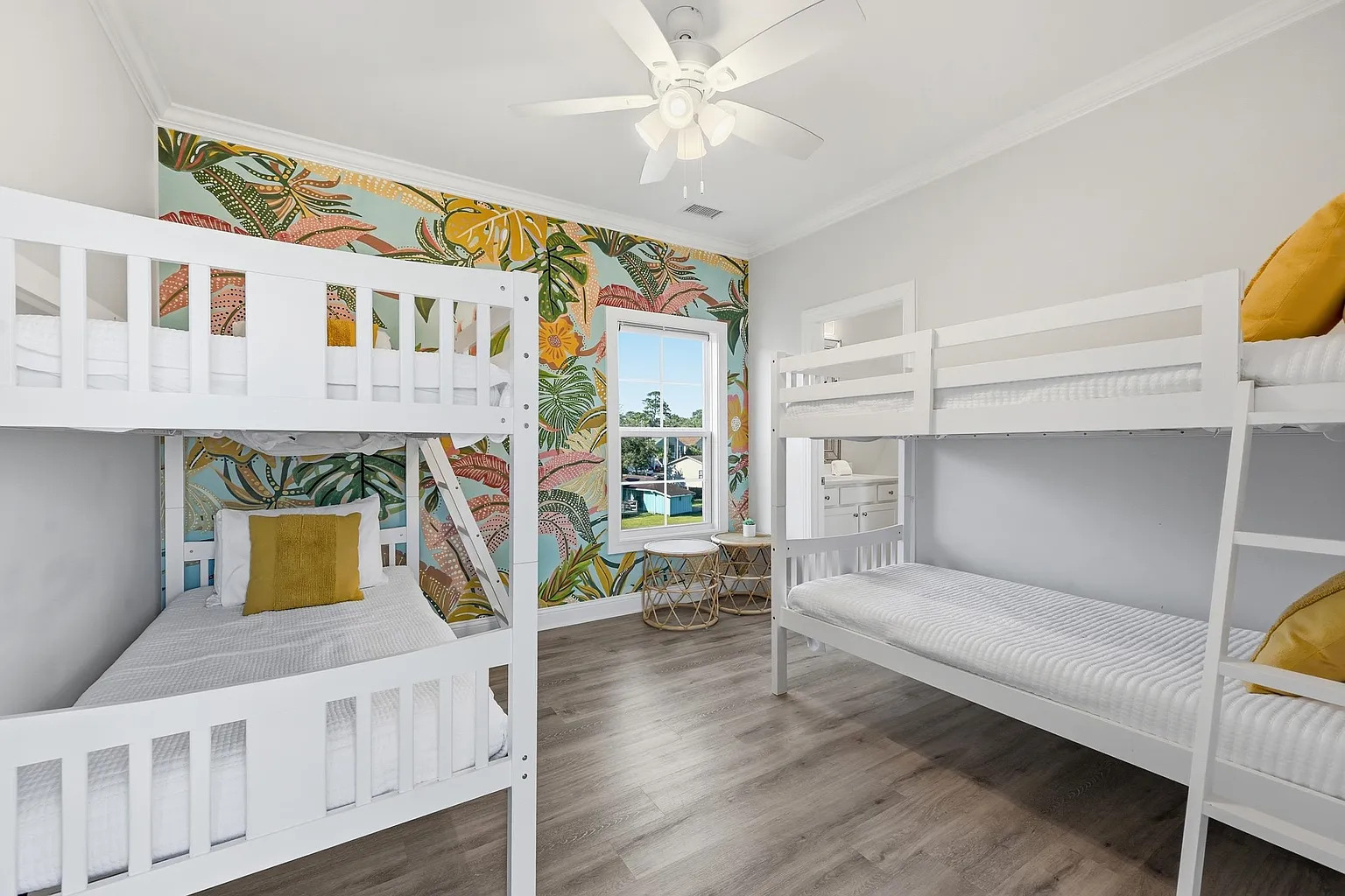 Queen bedroom with tropical yellow wallpaper at Banana Villa